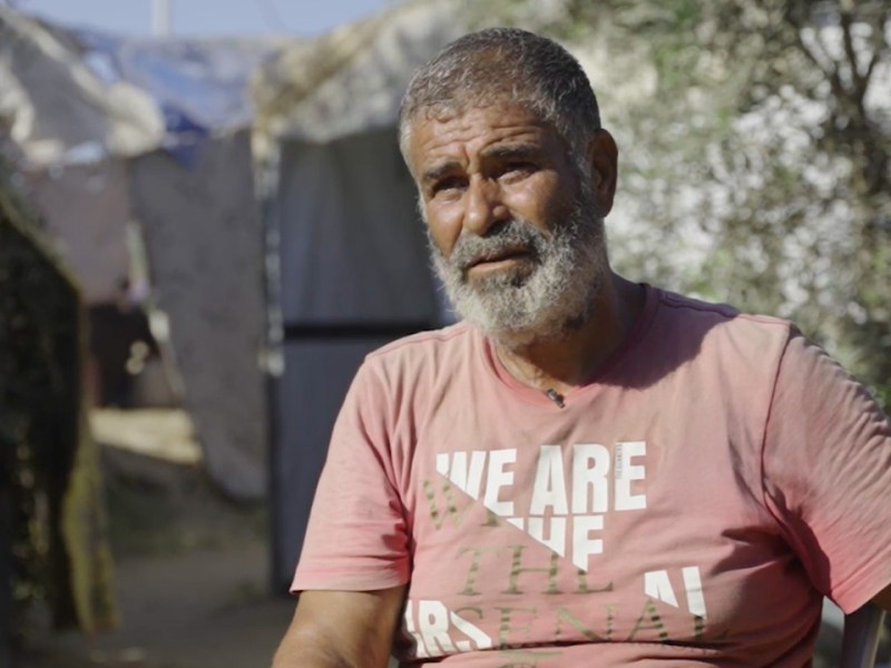 Rafik Hamdi Darwish Yasin speaks with The Real News from his shelter in the Gaza Strip. Screenshot from video by XXX