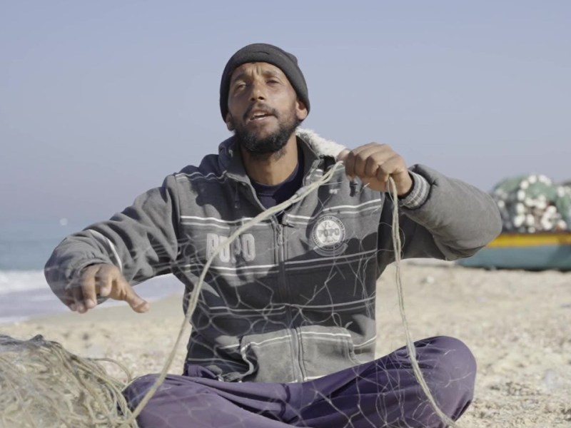 Ismail Mohamed, 35, prepares his fishing nets in Deir Al-Balah, Gaza.